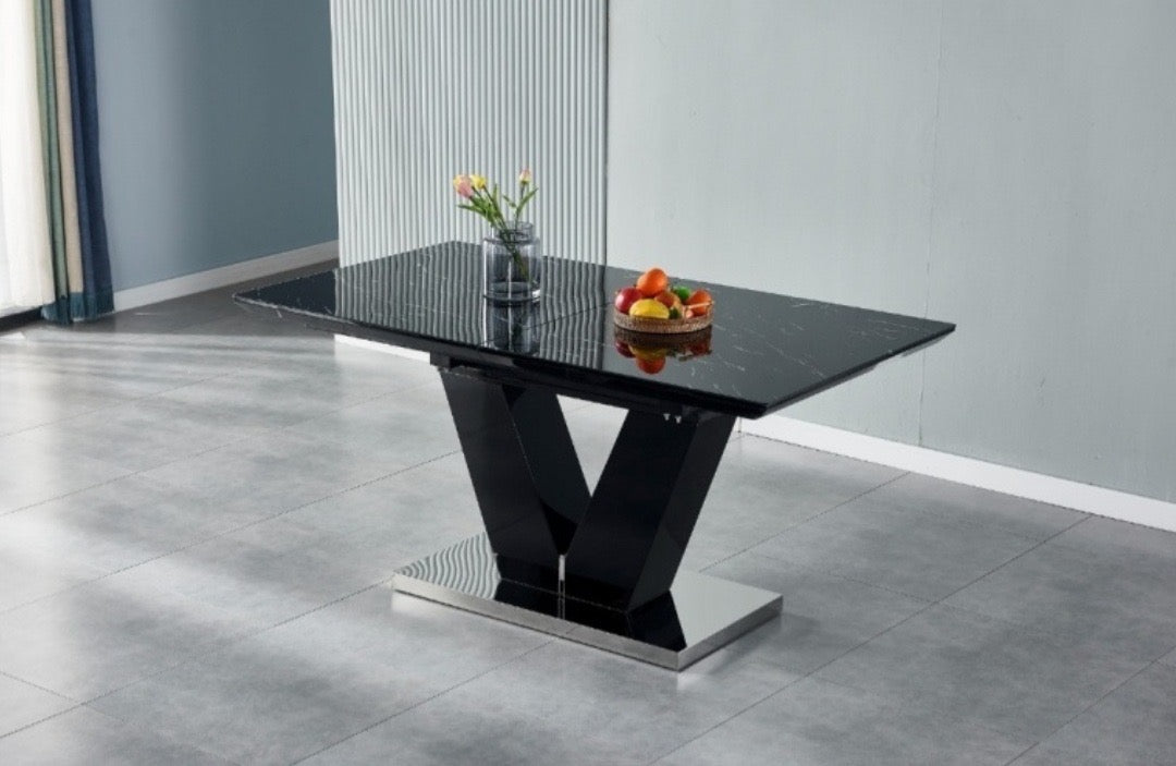 Table extensible noire effet marbre avec pied central en V design moderne et contemporain